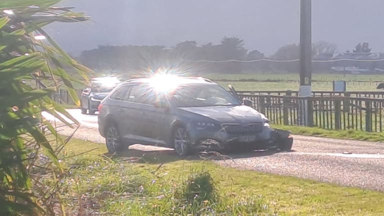 A police car was shunted to the other side of the road after being hit by the fleeing car.