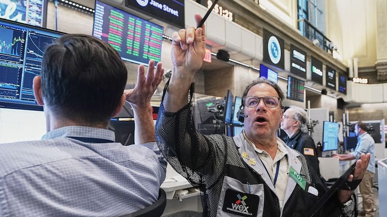 Options trader Anthony Spina, centre, works on the floor of the New York Stock Exchange.