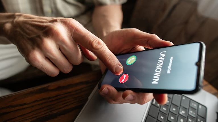 A person receiving a call from an unknown number (file image).