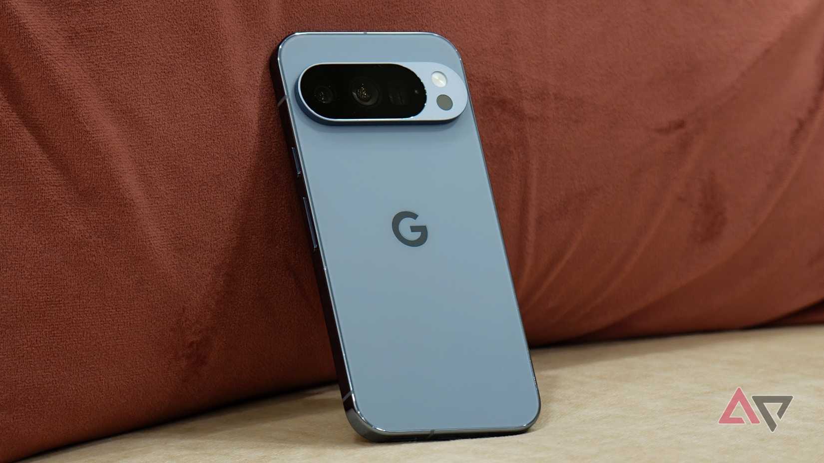 Pixel 10 Pro leaning against a pink cushion