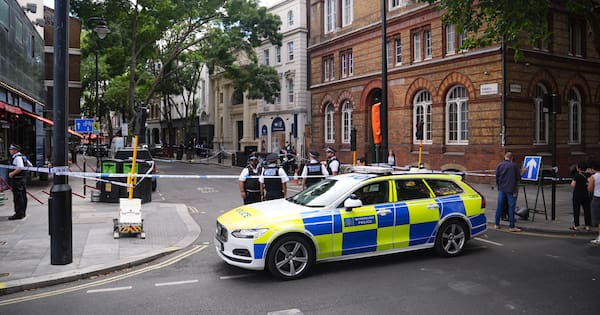 Four stabbed with scissors in central London, woman in custody
