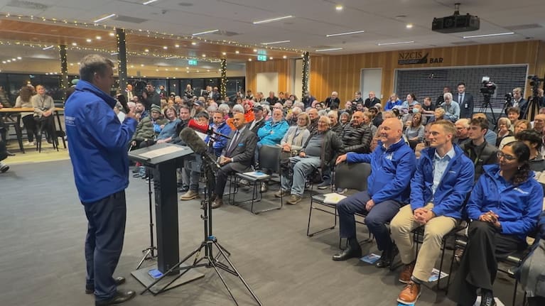 Prime Minister Christopher Luxon and Chris Bishopwere all smiles at a public meeting in the latter's electorate last night. 