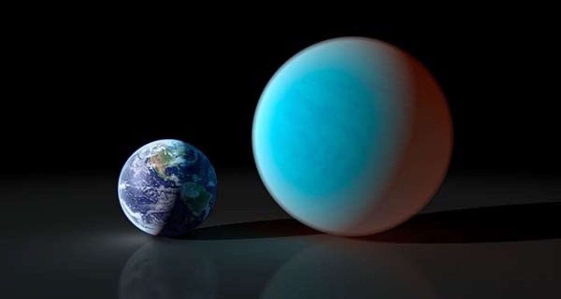 A small Earth is illustrated next to a large blue world.