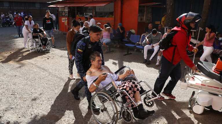 Residents and rescue workers search through the rubble of a collapsed building after an earthquake struck Cali, Colombia.