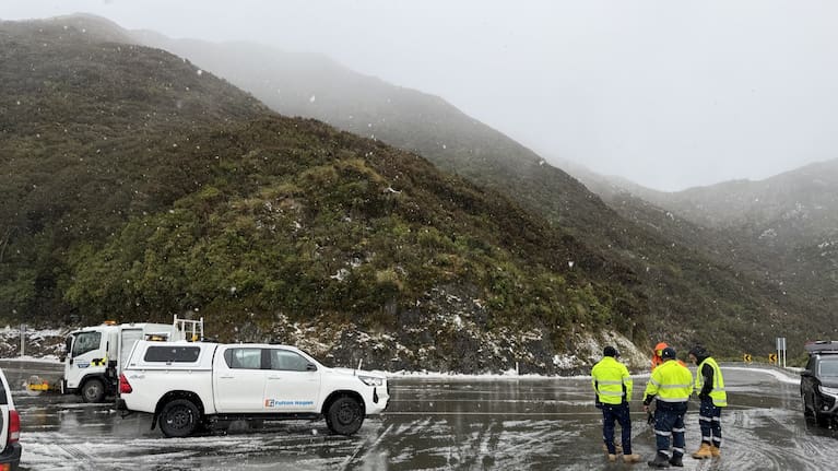 Road crews clear the snow at the Remutaka Hill lookout.