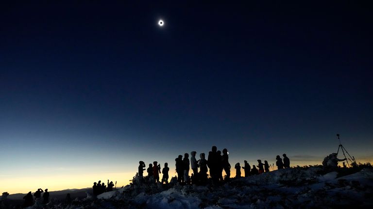 Skiers and hikers look at a total solar eclipse in Maine, US in 2024. File pic: AP