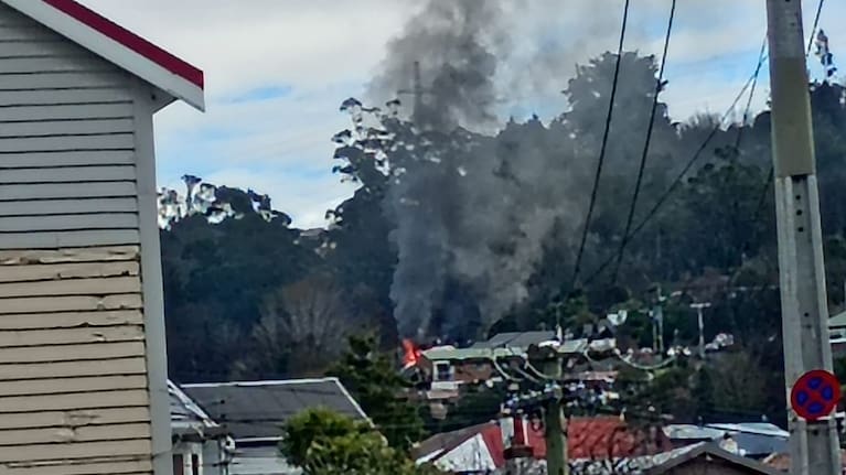 Smoke billows from a house fire in Dunedin's Caversham.