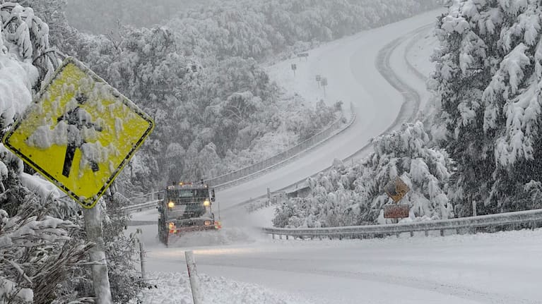 Snow blankets the road at Whites Bridge on State Highway 73.