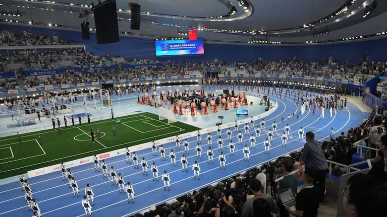 Spectators looking at robots perform during the opening ceremony of the World Humanoid Robot Games in Beijing, Saturday, August 22, 2026.