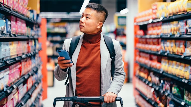 Man walking down an aisle in the supermarket (file image).