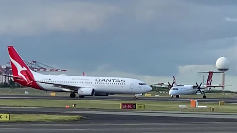 The two planes came close to colliding on Sydney's runway. Source: @amyfoxtrot via Nine.