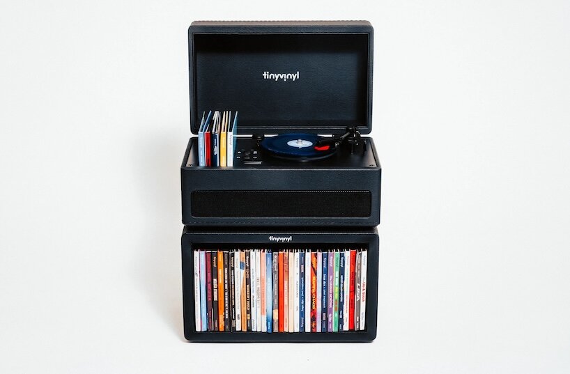 tiny vinyl player spins four-inch records on a miniature turntable - 1