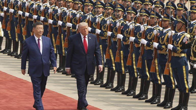 US President Donald Trump participates in a welcome ceremony with China's President Xi Jinping at the Great Hall of the People, Thursday, May 14, 2026, in Beijing. 