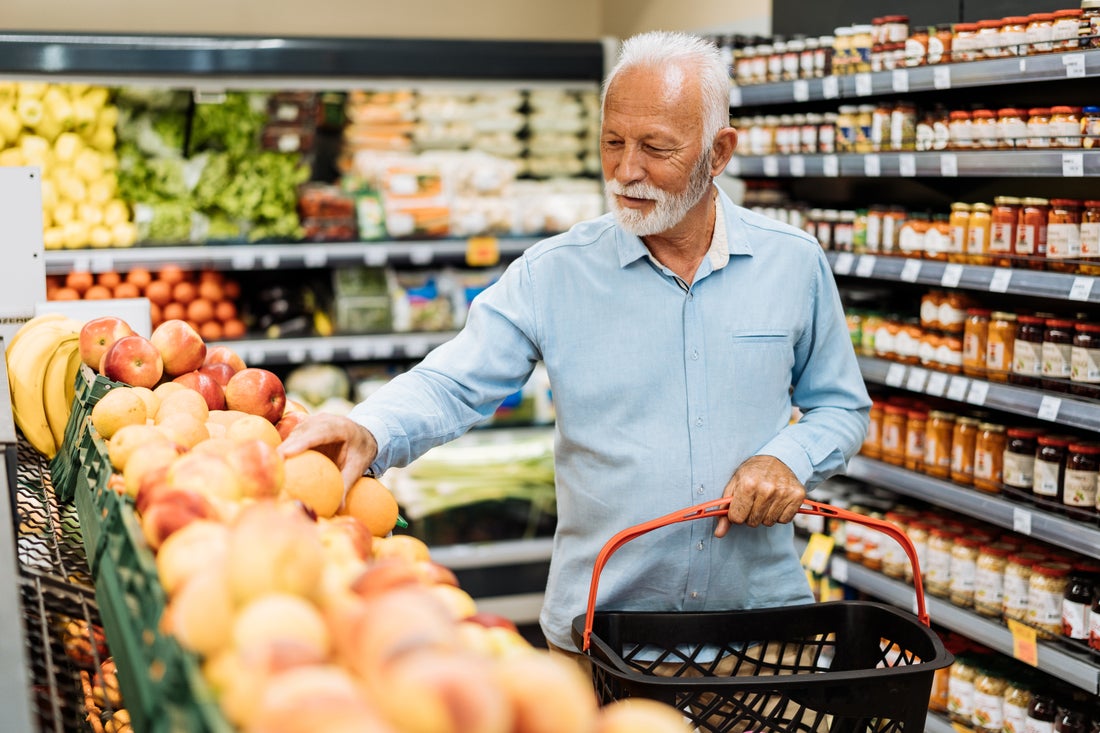 A person shopping for fruit in a grocery store.