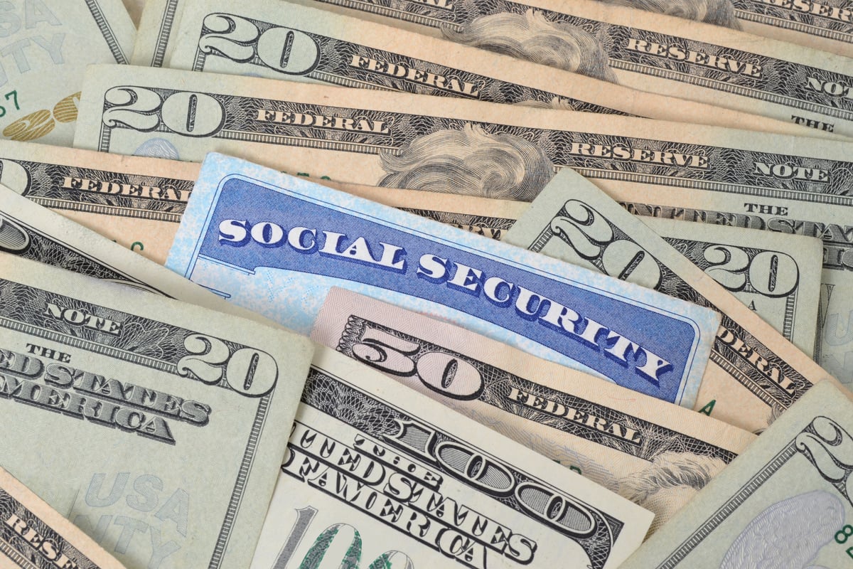 A Social Security card in a pile of cash.