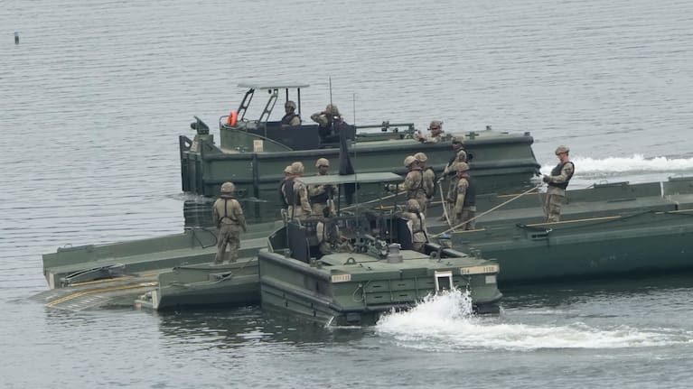 US Army soldiers try to dismantle a floating bridge during a training exercise on a river in Yeoncheon, South Korea, near the border with North Korea.