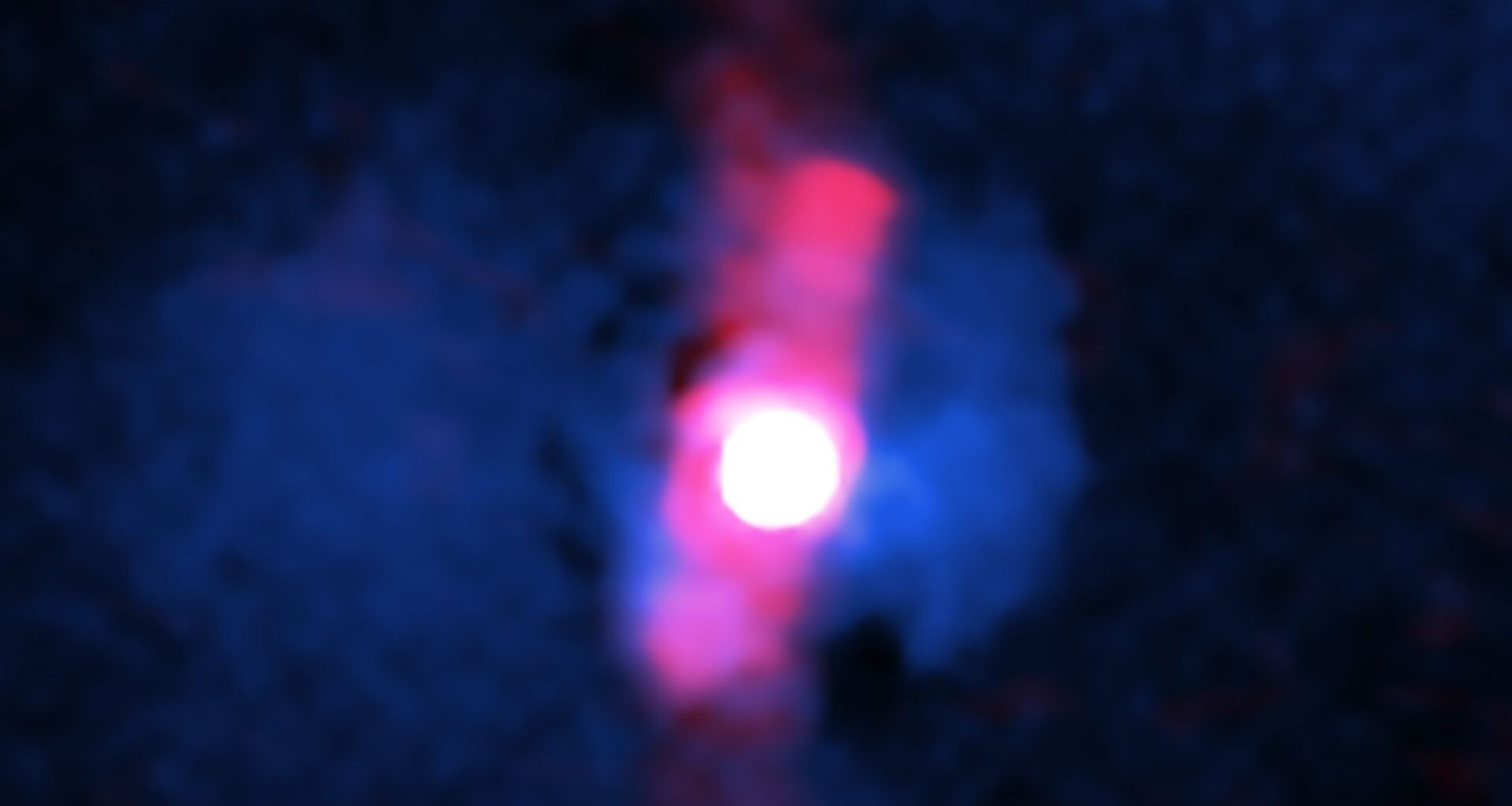 A blurry pinkish red circle surrounded by two jets of pink light.