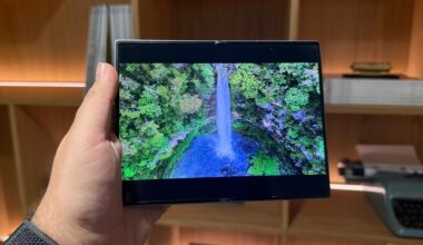 Samsung Galaxy Z Fold 8 smartphone held in hand unfolded, on screen is waterfall