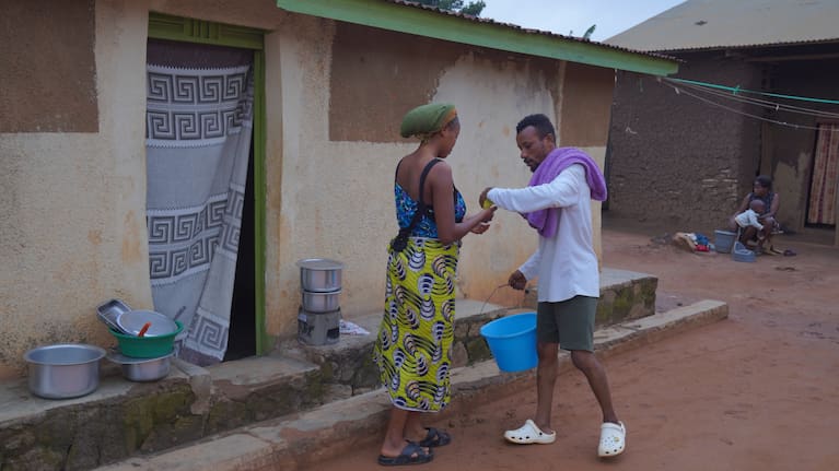 Wiza Bondele, right, a health worker on the prevention and control team, seen at his home in Ituri province, eastern Congo, Wednesday, August 5, 2026.