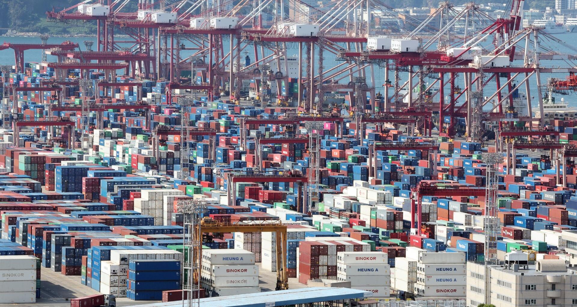 Containers bound for export are stacked at a port in Busan, Aug. 6. Yonhap