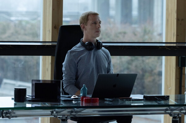 This image released by Sony Pictures shows Jeremy Strong as Mark Zuckerberg, in a scene from “The Social Reckoning.” (Leah Gallo/Sony Pictures via AP)