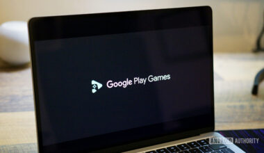 Google Play Games logo on a laptop screen.