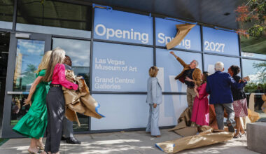 Distinguished guests tear off the ceremonial paper during a media preview and groundbreaking fo ...