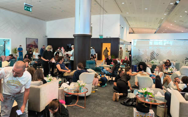 In this handout picture taken and obtained on September 30, 2026, passengers of the flydubai flight FZ1073 from Dubai to Tel Aviv are seen inside the Prince Sultan bin Abdulaziz Airport in Tabuk, after their plane was forced to land in Saudi Arabia. Two pilots were wounded after they reportedly fought on board the plane they were flying from Dubai to Tel Aviv, and which was forced to make an emergency landing in Saudi Arabia on September 30. The flydubai plane landed in Tabuk "at 9:45 am (0645 GMT) and its captain and copilot were found to have injuries and were transported to hospital", a statement from the company operating the airport said. (Photo by Courtesy Of An Anonymous Source / AFP) / NO USE AFTER OCTOBER 9, 2026 13:49:25 GMT - NO USE AFTER OCTOBER 9, 2026 13:49:25 GMT - RESTRICTED TO EDITORIAL USE - MANDATORY CREDIT "AFP PHOTO / COURTESY OF AN ANONYMOUS SOURCE" - HANDOUT - NO MARKETING NO ADVERTISING CAMPAIGNS - DISTRIBUTED AS A SERVICE TO CLIENTS - NO ARCHIVE - NO USE AFTER: OCTOBER 9, 2026...