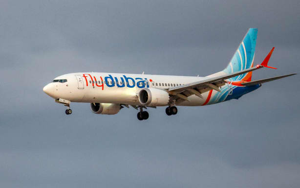 A flydubai Boeing 737 MAX 8 aircraft prepares for landing at Israel's Ben Gurion Airport in Lod on September 30, 2026. A passenger on a rerouted flydubai flight that was bound for Tel Aviv said one of the pilots tried to crash the plane and kill everyone on board, after both pilots were found to be wounded on landing in Saudi Arabia. In the first comment by an official, Israel's far-right national security minister Itamar Ben Gvir alleged an attempted "terrorist" attack in the incident, in which none of the passengers reported injuries. (Photo by Jack GUEZ / AFP)