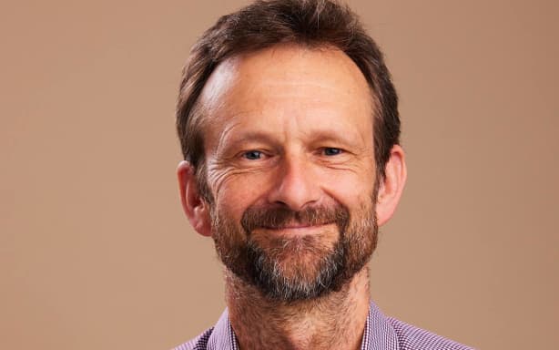 A headshot portrait of climate change commissioner and climate scientist Dr Andy Reisinger