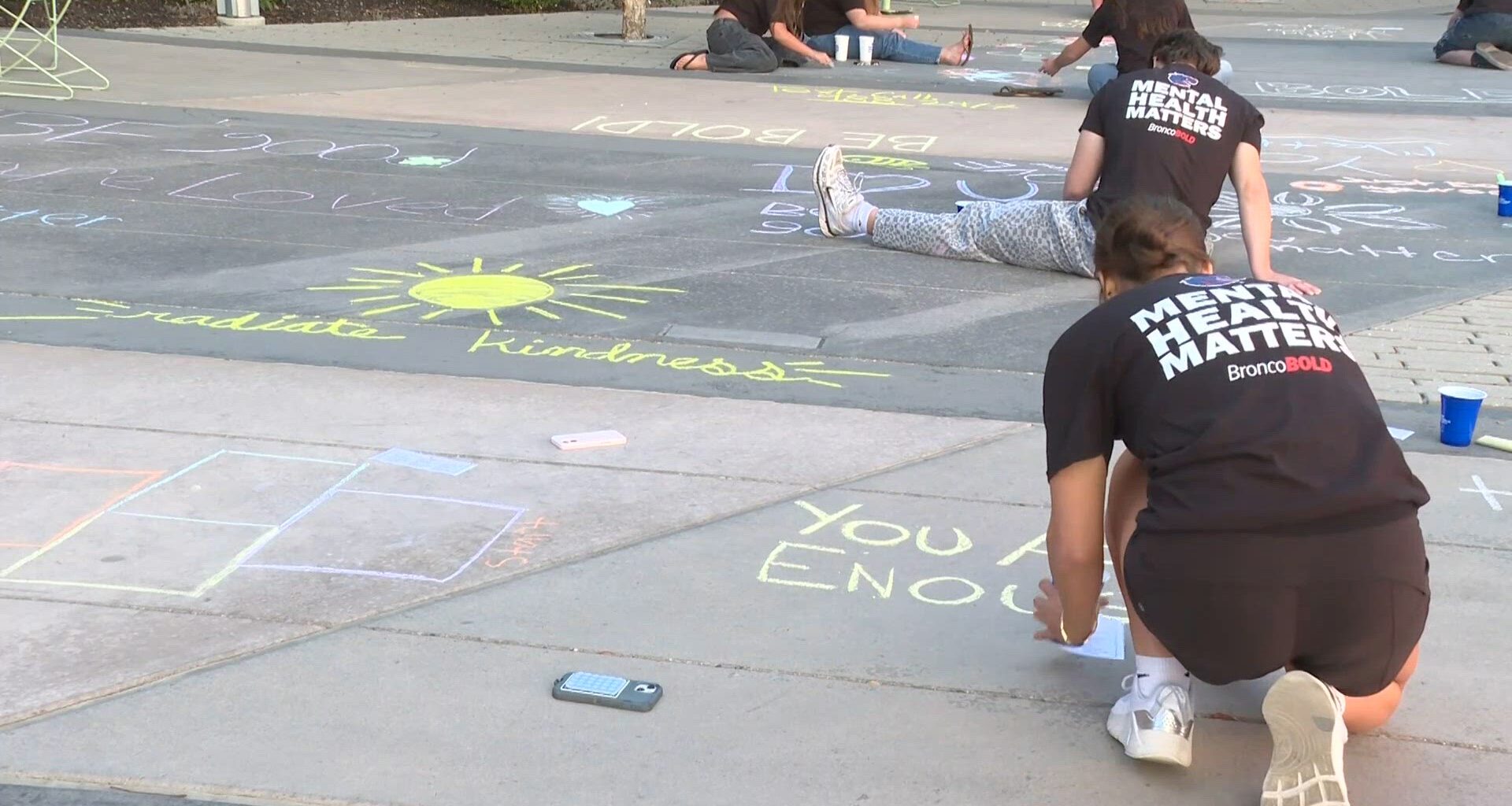 Boise State athletes and locals chalk streets to promote mental health awareness
