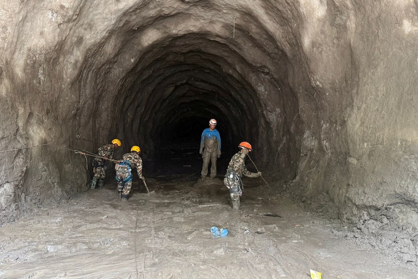 Rescue personnel work at a hydropower tunnel site in Rasuwa.