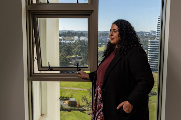 Estelle Grech of the Committee for  Sydney next to a window in the Boronia development in Norwest Quarter. Awnings are the default in high-rise apartments, but they restrict the opening to 125mm – just 12.5% of the sash area is actually open to fresh air.