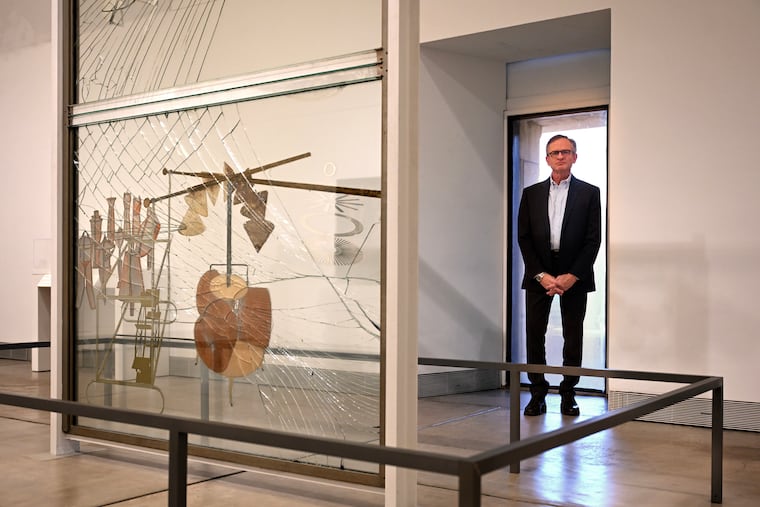 Daniel H. Weiss, director and CEO of the Philadelphia Art Museum, is photographed Jan. 7. In front is the piece, “The Bride Stripped Bare by Her Bachelors, Even” (1915–1923, also called The Large Glass) by the French American avant-garde artist Marcel Duchamp.