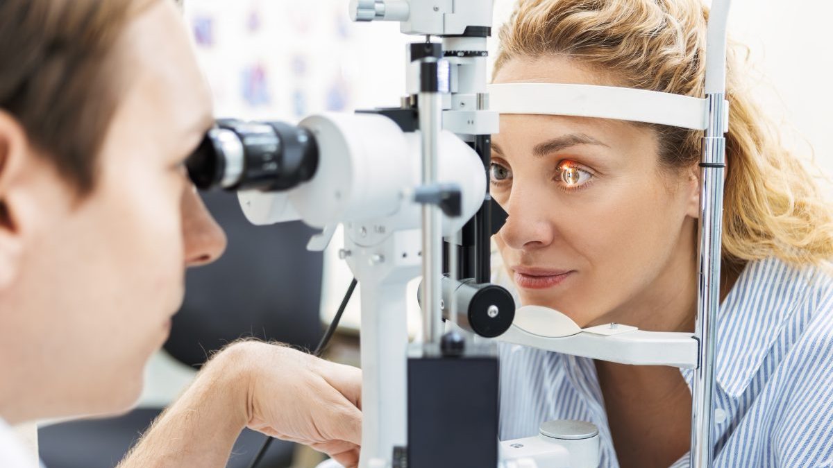 Woman Undergoing Vision Test at Eye Doctor - stock photo