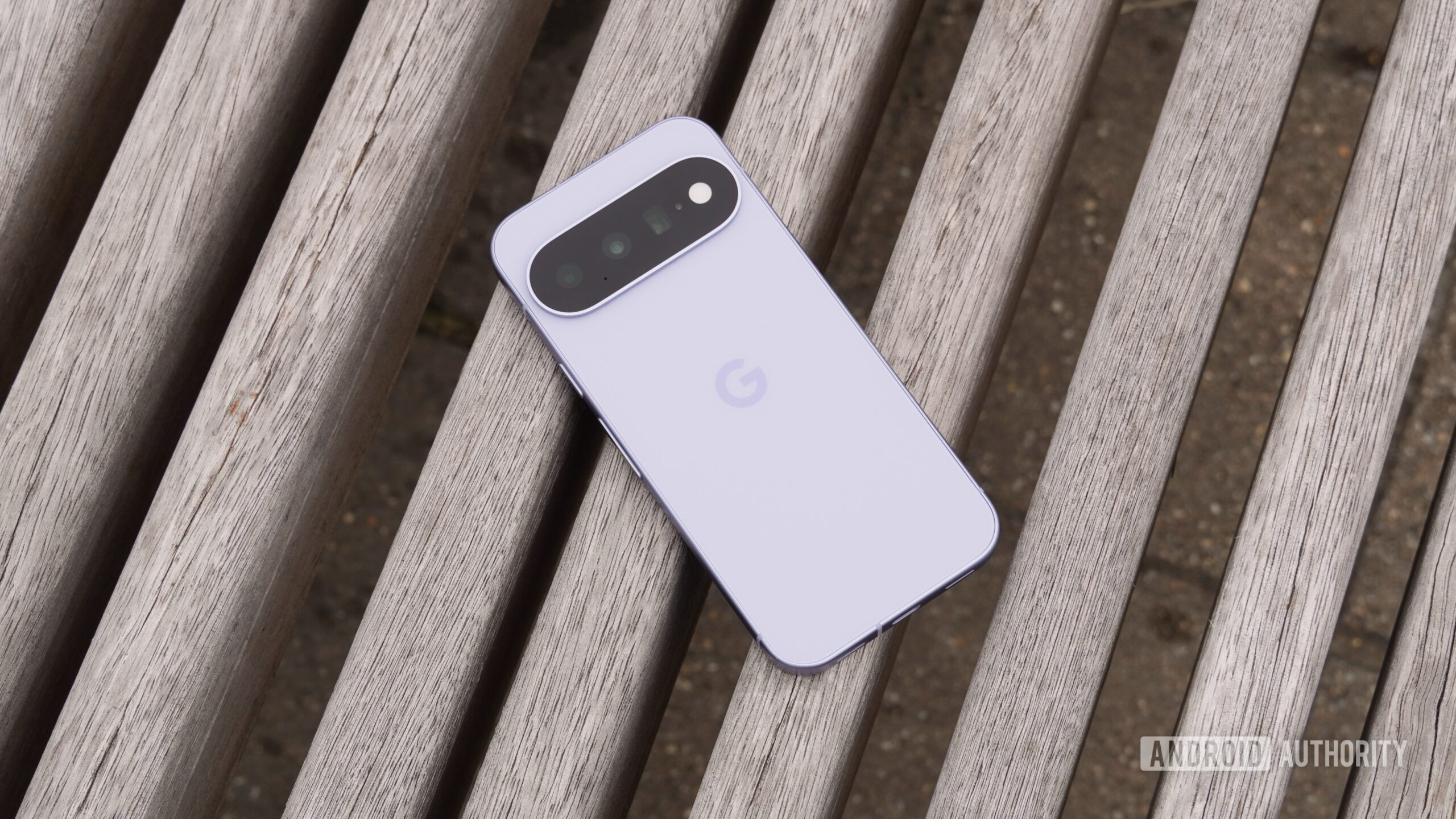 The back of the Google Pixel 11 on a wooden bench.