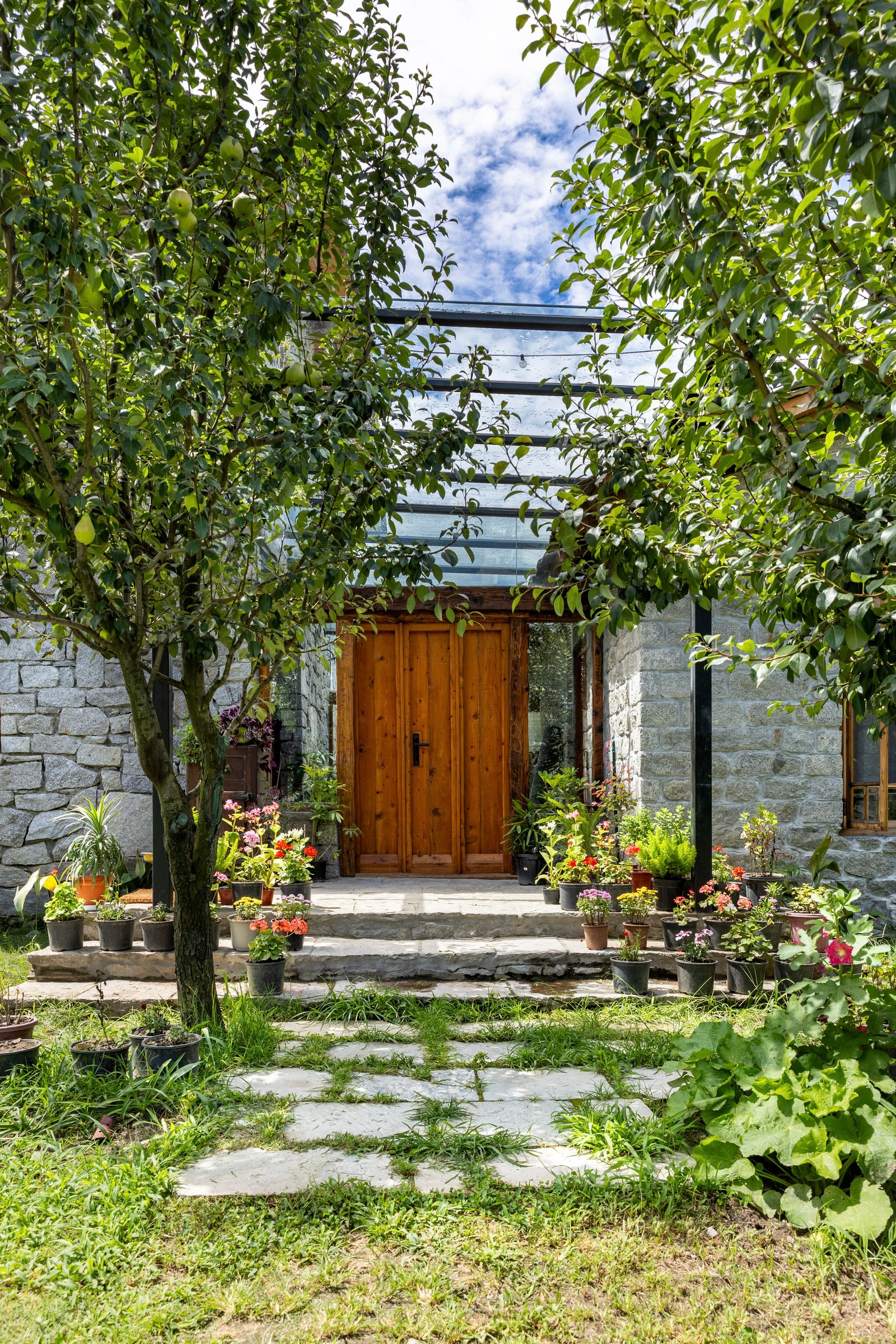 Image may contain Garden Nature Outdoors Architecture Building House Housing Porch Indoors and Interior Design