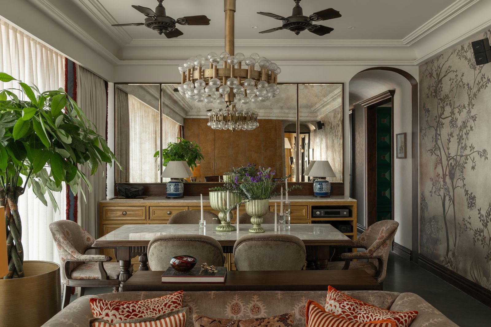 Image may contain Chandelier Lamp Architecture Building Dining Room Dining Table Furniture Indoors Room and Table