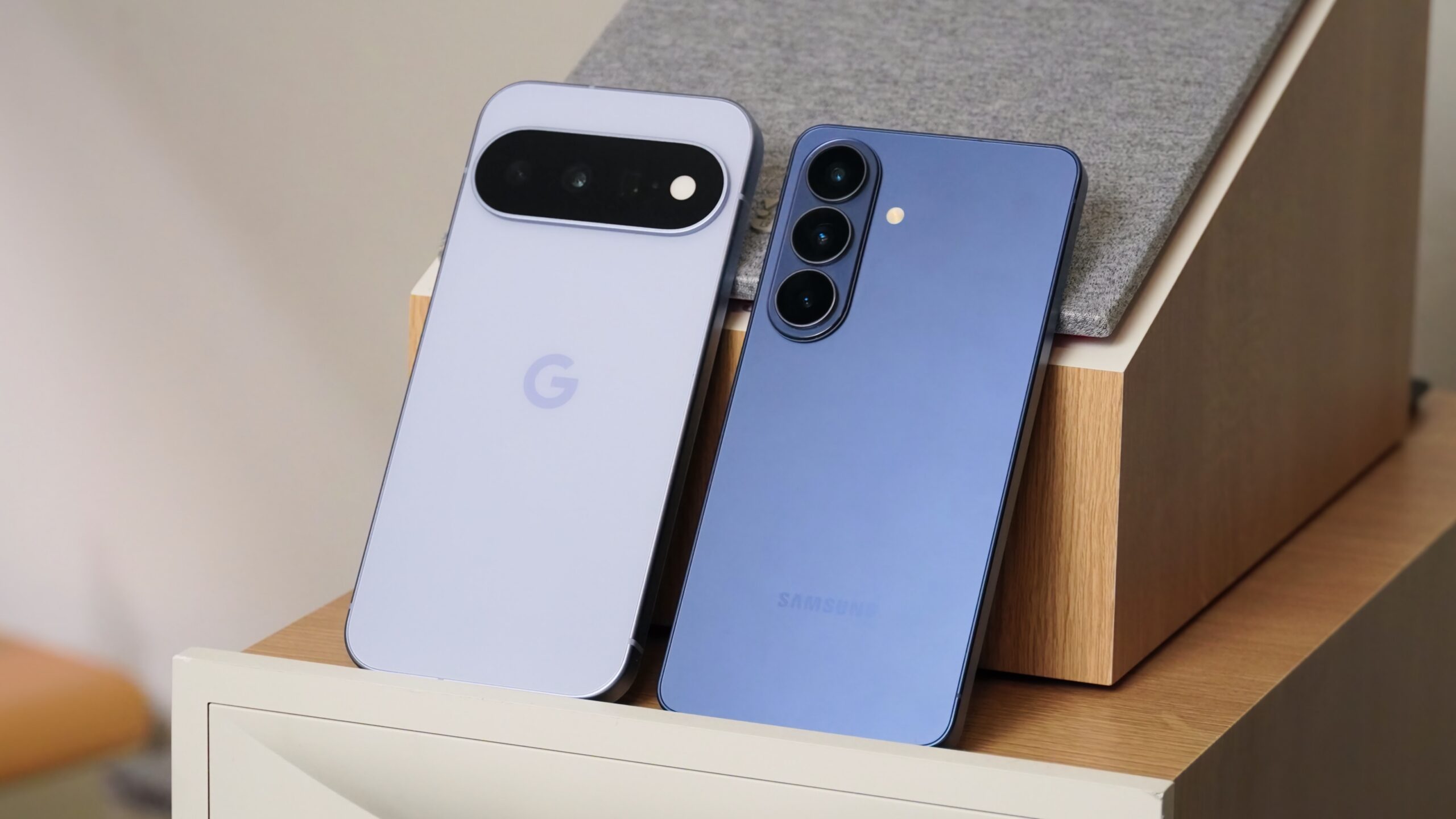 The Google Pixel 11 (left) beside the Samsung Galaxy S26 (right).