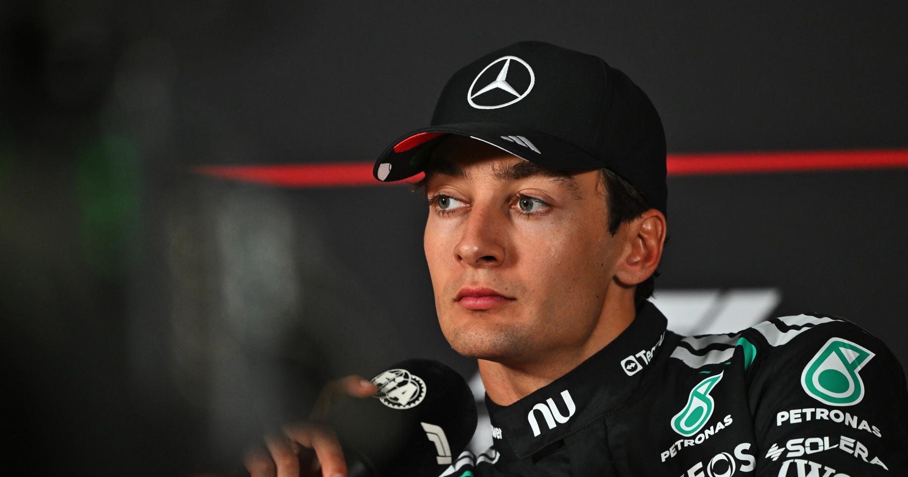 George Russell demands major change after 'sore head' pain