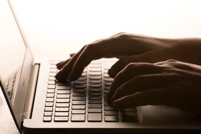 File photo dated 04/03/17 of a person using a laptop. More than half of young people in the UK have used an AI chatbot such as ChatGPT in the last year to help them with schoolwork, emails or their job, research suggests. Issue date: Monday November 20, 2023. PA Photo. Nominet's latest annual Digital Youth Index, which examines young people's online habits and attitudes, suggests that while most young people (94%) feel safe online, 76% said they had been exposed to an upsetting experience. See PA story TECHNOLOGY Internet. Photo credit should read: Dominic Lipinski/PA Wire