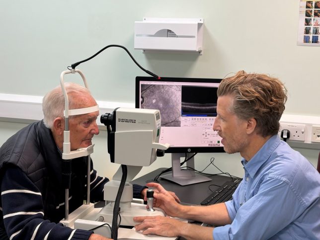 Undated handout photo issued by Moorfields Eye Hospital of John Brewer (left) with Josef Huemer, consultant ophthalmologist at Moorfields Eye Hospital. Mr Brewer, from Croydon, was told he had atrial fibrillation while on the operating table. It comes as a study by Moorfields Eye Hospital NHS Foundation Trust and UCL Institute of Ophthalmology found eye scans could detect AF on average four years before diagnosis. Issue date: Tuesday September 15, 2026. PA Photo. Photo credit should read: Moorfields Eye Hospital/PA Wire NOTE TO EDITORS: This handout photo may only be used in for editorial reporting purposes for the contemporaneous illustration of events, things or the people in the image or facts mentioned in the caption. Reuse of the picture may require further permission from the copyright holder.