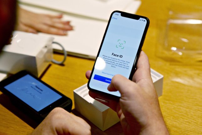 A customer sets up Face ID on an Apple Inc. iPhone XS during a sales launch at a store in Chicago, Illinois, U.S., on Friday, Sept. 21, 2018. The iPhone XS is up to $200 more expensive than last years already pricey iPhone X and represents one of the smallest advances in the product lines history. But that means little to the Apple Inc. faithful or those seeking to upgrade their older iPhone. Photographer: Daniel Acker/Bloomberg via Getty Images