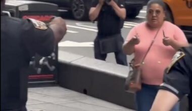 Police officers confront Pamela Cisneros on Monday after she stabbed two people in Times Square. Credit: X