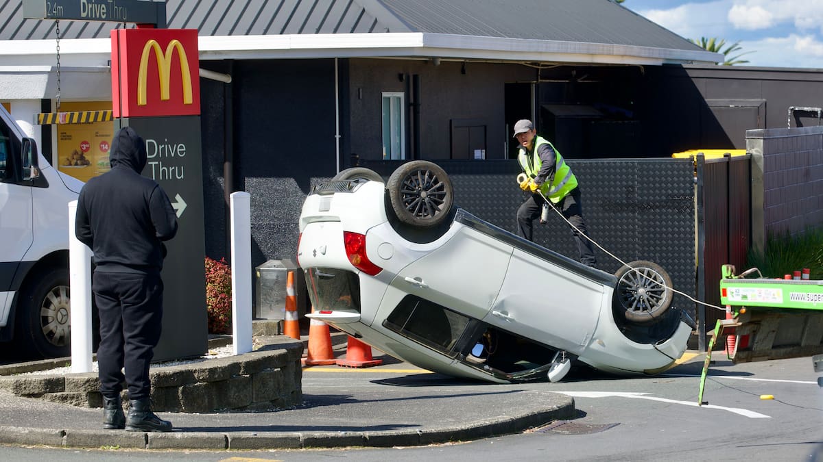 Car on its roof at Kelston McDonald’s drive-thru, police say parking mishap