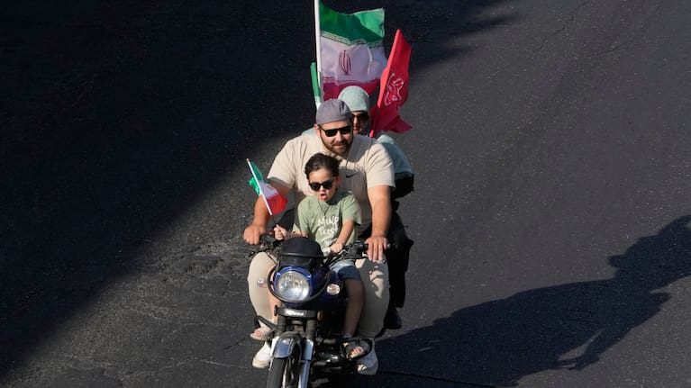 A family ride on a motorcycle during a state-organized motorcycle parade called "Janfada," meaning "Sacrifice for Iran,", in Tehran, Iran, Friday, Sept. 25, 2026.