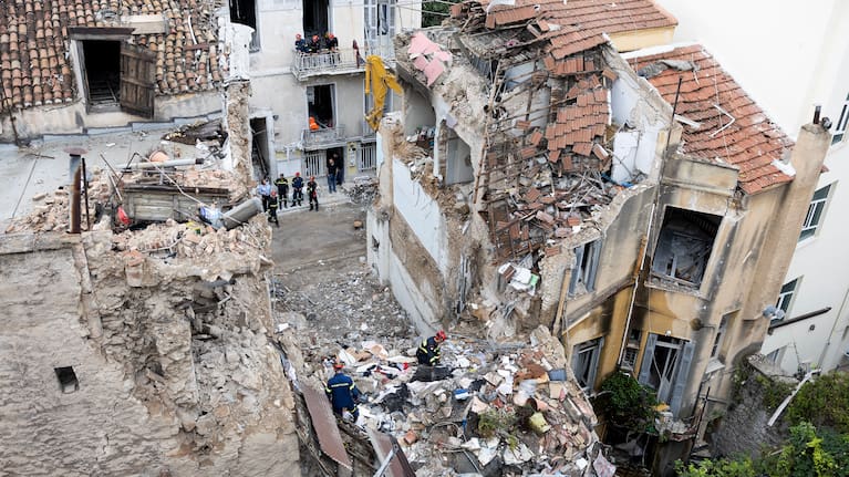 A rescuer works at the scene following Friday's powerful blast in Athens' Plaka district. 