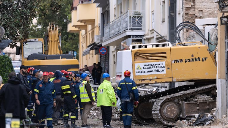 A rescuer works at the scene following Friday's powerful blast in Athens' Plaka district. 