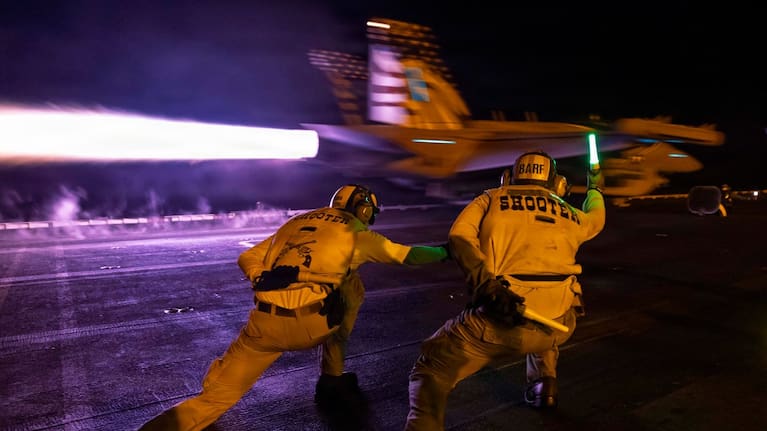 A US jet takes off from the deck of of USS George H.W. Bush. 