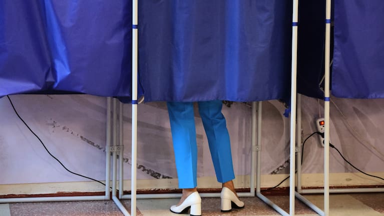 A voter fills-in a ballot during Russia's parliamentary election in Donetsk, in the Russian-controlled part of the Donetsk region, Ukraine.